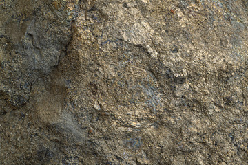 Pyrite polymetallic ore texture close-up. Contains pyrite, chalcopyrite, sphalerite, galena and barite. Siberian natural resources deposit. Mineral stone surface abstract background.