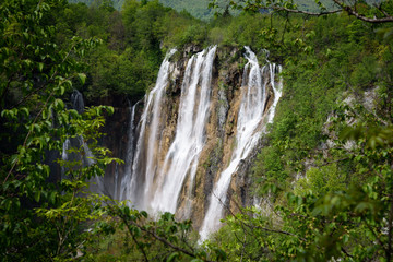 Fototapeta na wymiar Waterfalls seen from the viewpoint, in the Plitvice Lakes Nature Park, forest reserve located in central Croatia, Europe.