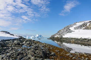  Antarctic landscape with mountains and reflection