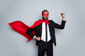 Portrait of nice attractive content authoritative bossy guy wearing suit hero look demonstrating muscles air wind blow fly motivation rescue isolated over grey pastel color background © deagreez