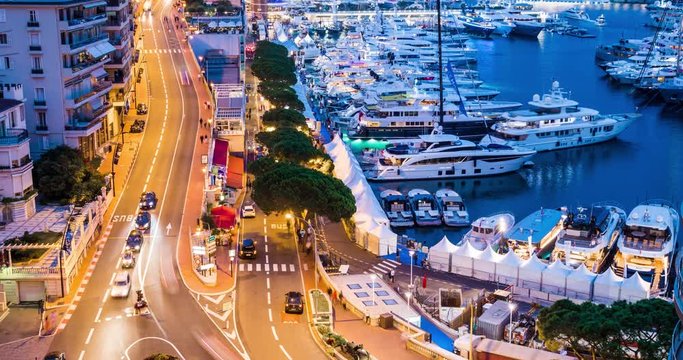 Monaco, Monte-Carlo 30.09.2017: Time-lapse of movement of boats in port, boat yacht show, event is over, the richest people from around the world, cityscape, tenders, mega yacht, night lights