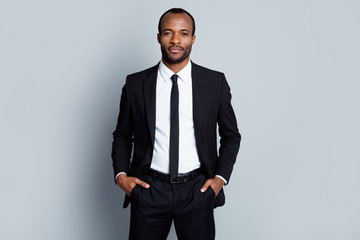 Portrait of confident intelligent afro american man marketer representative put hands pocket pants...