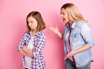 Portrait of outraged mother have misunderstanding with daughter scream kid cross hands avoid feel...