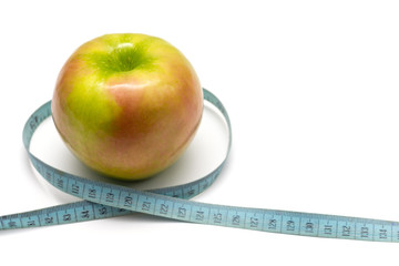 apple with old blue measuring tape on a white background