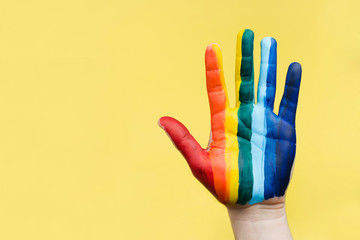 Hand painted as a rainbow flag. LGBTQ concept. Hand LGBT close up