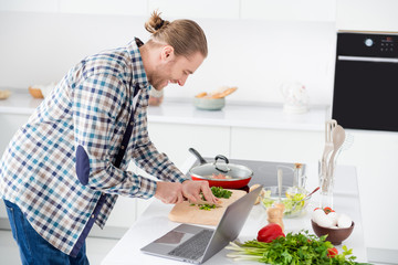 Profile side view portrait of his he nice attractive cheerful focused guy making tasty yummy...