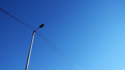 power lines in the little noisy blue  sky