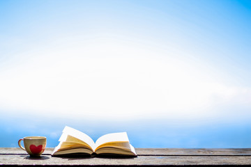 The Bible placed on the table was opened for learning to understand the Bible in order to pray to...
