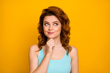 Hmm. Closeup photo of funny pretty curly lady hold hand on chin interested cunning look up empty...