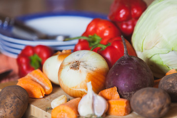 Vegetable still life. Onions, beets, cabbage on the board