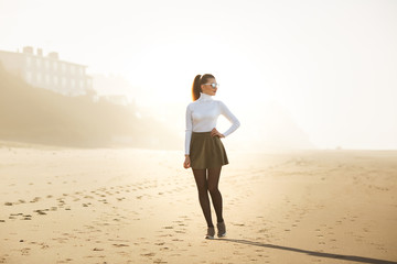 woman enjoying a walk on the beach