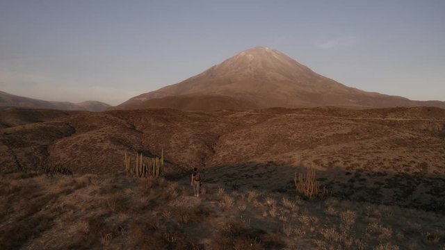 Drone shot of a Guy walking by in the Misti Volcano 