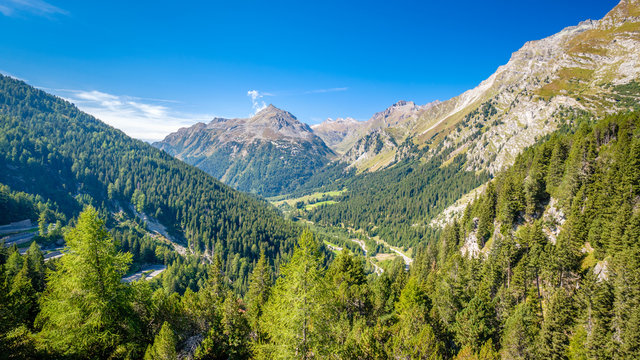 Looking into the valley Val Bregaglia (German: Bergell) when standing on top of the Maloja Pass (Engadin, Switzerland), a high mountain pass in the Swiss Alps in the canton of Graub&uuml;nden