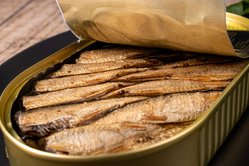 Sprats in oil. Smoked canned fish of sprat, herring and other small fish in oil.