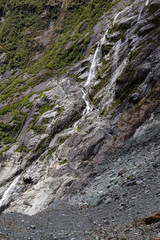 Franz Joseph Glacier and small waterfall. New Zealand