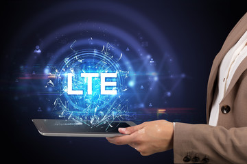 Close-up of a touchscreen with LTE abbreviation, modern technology concept