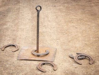 An Old Fashioned Game of Horse Shoe Throwing
