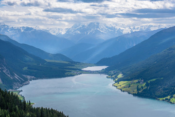 The walking trail from Bergkastel (2,200m, Tyrol, Austria) to the raised bog (German: hochmoor) Plamort features great views on Lake Resia (German: Reschenenmeer) and Haidersee (South Tyrol, Italy)