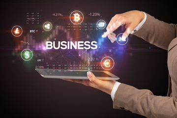 Close-up of a touchscreen with BUSINESS inscription, business opportunity concept