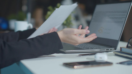 Employee throws report on boss table. Close up