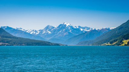 View of Lake Resia (German: Reschensee) and Ortler Mountains in Val Venosta (Alto Adige, Italy). It lies next to Lake della Muta (German: Haidersee) and across the Austrian border at the Resia Pass