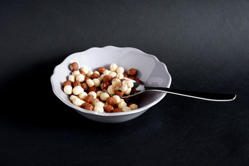 Chocolate balls Breakfast on a black background. Suitable for mockups and advertising backgrounds