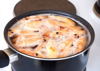 Prawns are cooked in a pot