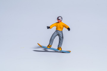 miniature figures concept of snowboarder