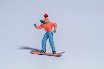 miniature figure snowboarder