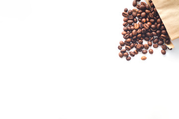 coffee beans are scattered on a white background.