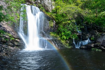 waterfall with rainbow scenic nature