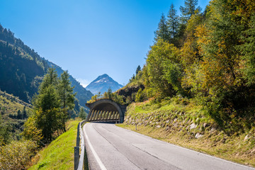 Asphalt road that leads through a tunnel further into the Austrian Ötztal (Tyrol, Austria) to the...