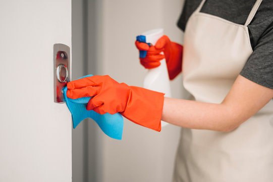 Woman Cleaning Elevator Buttons. Home Clean