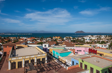 Fototapeta na wymiar Town of Corralejo, Fuerteventura, Canary Islands, Spain, Europe. Top view from shopping center. October 2019