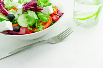 Salad with tomato and pepper, a plate of salad