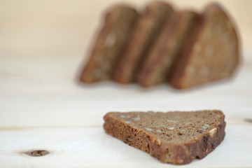 Healthy eating Sliced rye bread on a wooden background