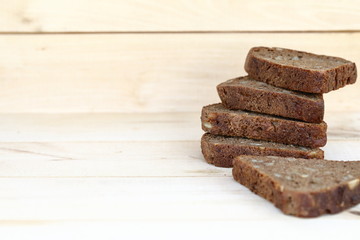 Healthy eating Sliced rye bread on a wooden background