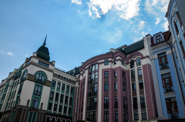 Fototapeta premium Colored residential buildings with multicolored facade on the central part of Kyiv city of elite district Vozdvyzhenka 