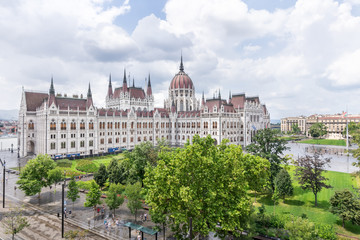 Naklejka premium Hungarian parliament building from behind on a sunny day in summer season in Budapest, Hungary - aerial view.