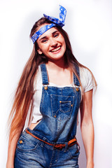 young pretty blond girl hipster posing frendly against white background wall, smiling woman with long hair