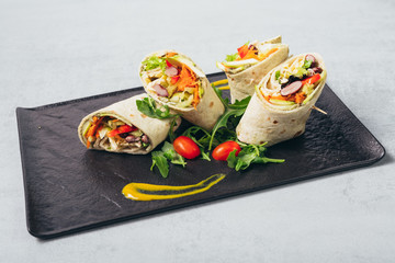 tortilla rolls served on plate