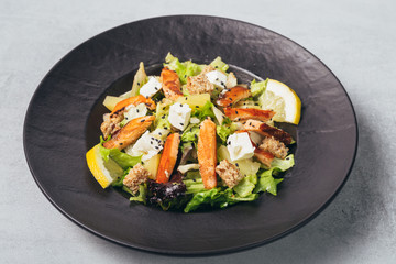 tasty salmon salad served on plate