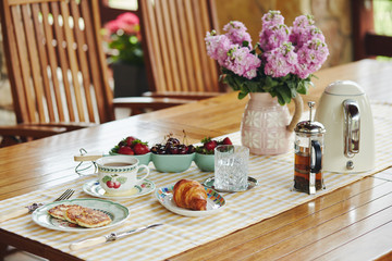 Healthy breakfast in the garden in summer