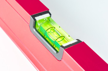Close-up  of   red   Spirit Levels  used in construction on white  background  .