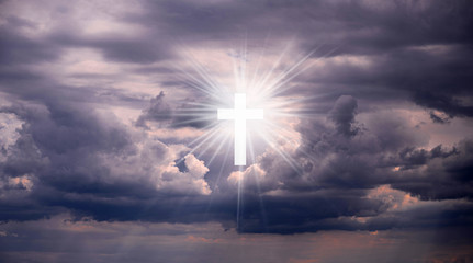 Religious background with Holy Cross glowing. Christian cross in a sky with some clouds