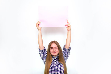 A young girl in a plaid shirt with long hair holds a large sheet, a frame for text in front of her, above herself, from the side. The girl demonstrates, offers,  points