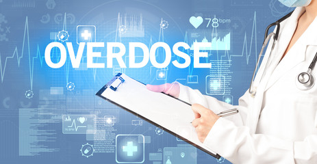 young doctor writing down notes with OVERDOSE inscription, healthcare concept