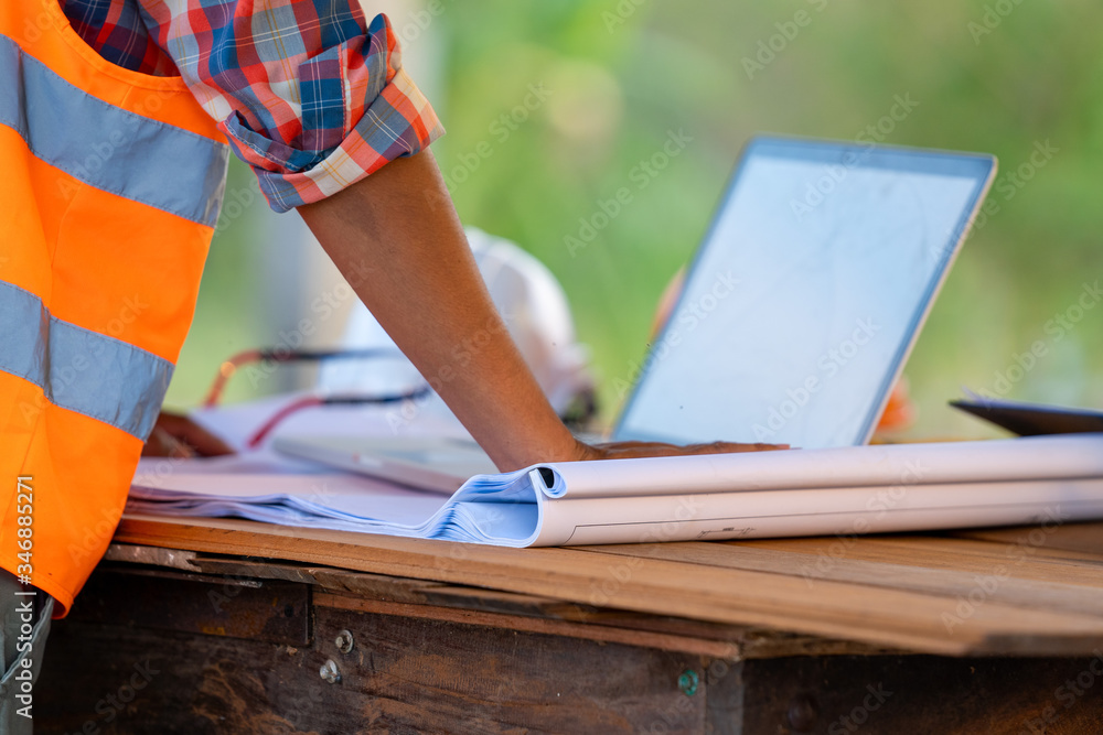 Aufkleber engineer working with laptop and blueprints,engineer inspection in construction site for architectur