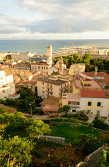 Fototapeta na wymiar Panoramic aerial view of the city of Salerno in southern Italy. The point of view is from the Minerva garden an ancient medical botanic place designed on many levels. Magical atmosphere, out of time.