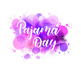 Pajama day - handwritten modern calligraphy lettering text on multicolored watercolor paint splash background.